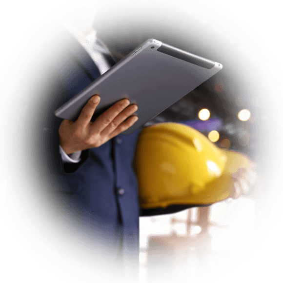 Industrial worker holding tablet.